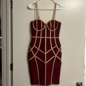 Burgundy dress with gold designs and straps